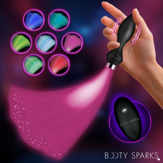 Black silicone vibrating butt plug with glowing blue fiber optic tail