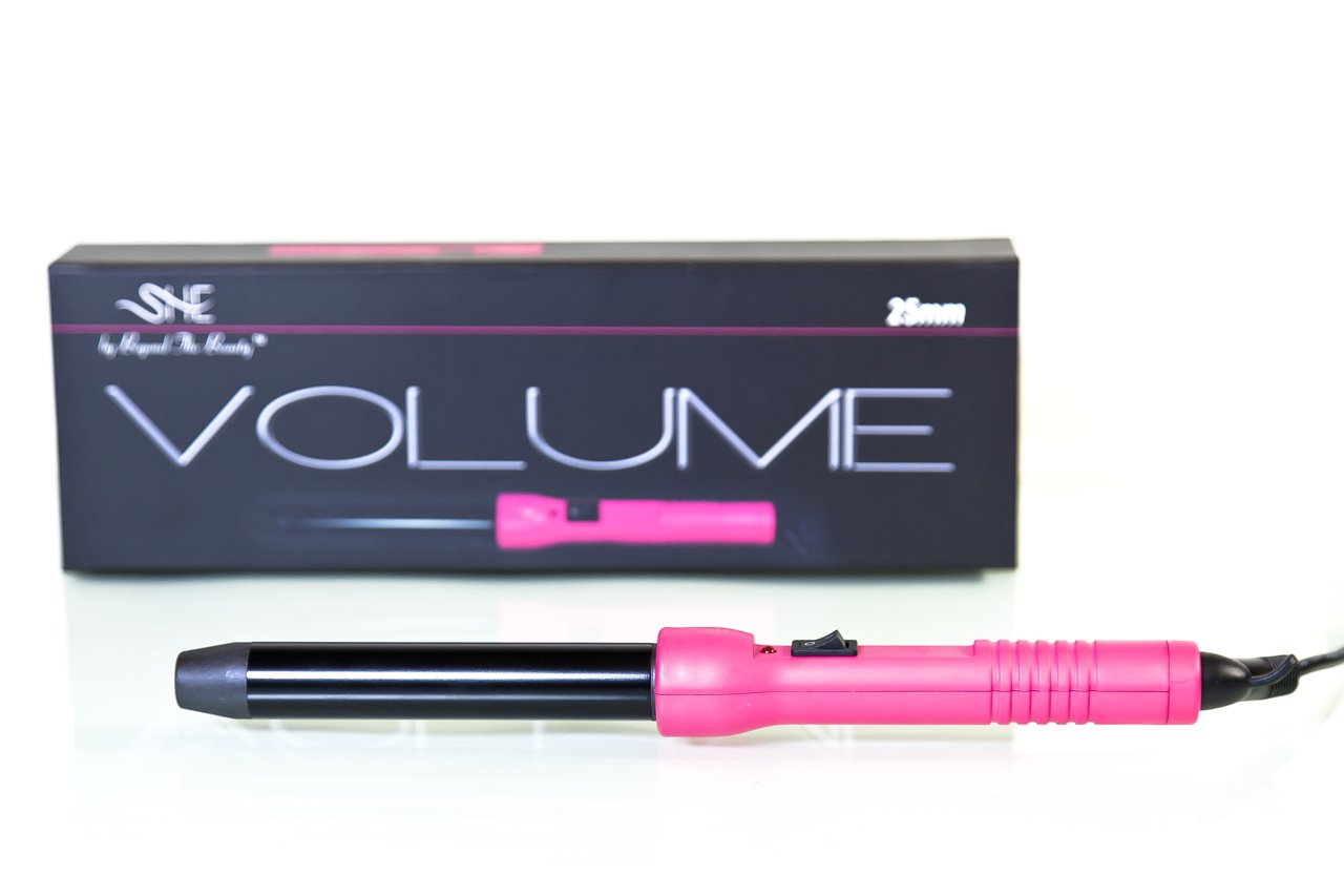 Pink hair curling iron with black barrel and packaging labeled 'VOLUME' on a white background.
